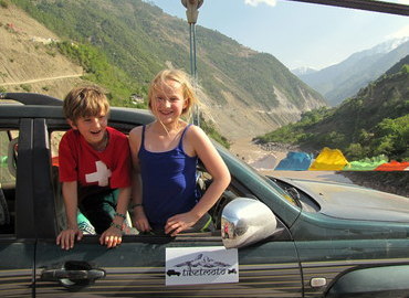 Kids in a jeep, Tibet.