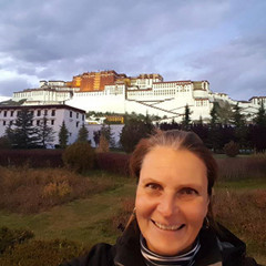 Stefanie Trippler stands in front of  the Potala Palance