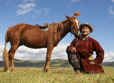 Tibetan Nomads with their horse.