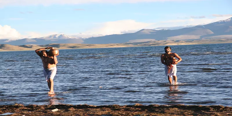 Pilgrims collect water from lake manasarovar