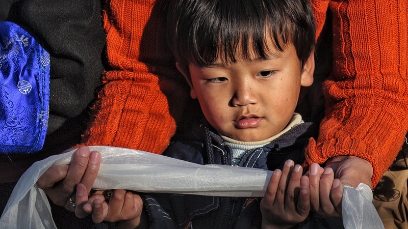 The white Khata is a symbol of Tibetan etiquette.