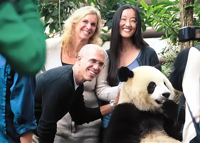 Tourists are obsessed with a lovely panda.
