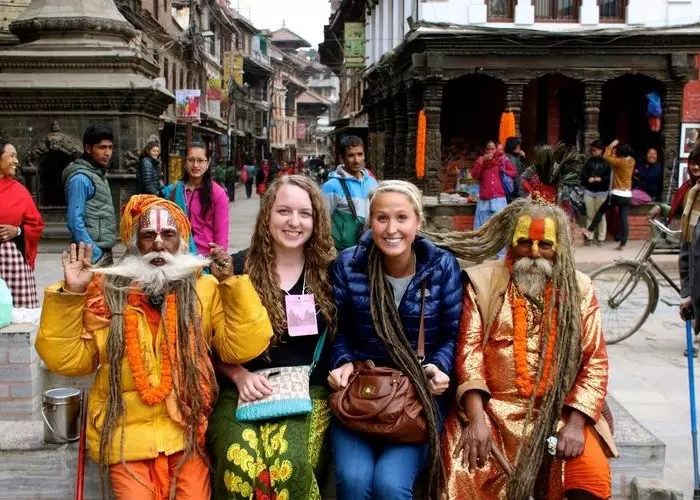 tourists with sadhus on the street
