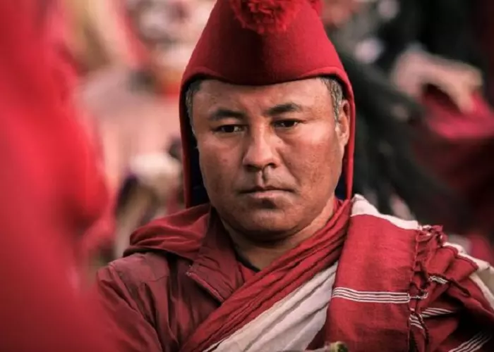 Monks of Nyingma school wear red hats.